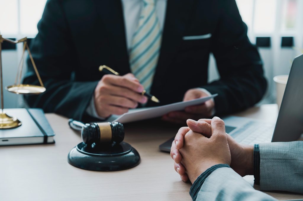 Lawyer is providing information about the client's trial at the lawyer office. Businessman and Male