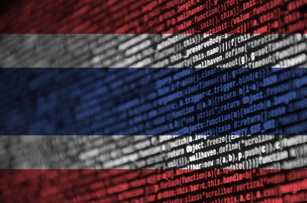 Thailand flag is depicted on the screen with the program code