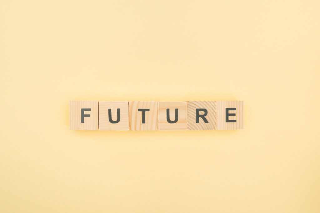 top view of future lettering made of wooden cubes on yellow background