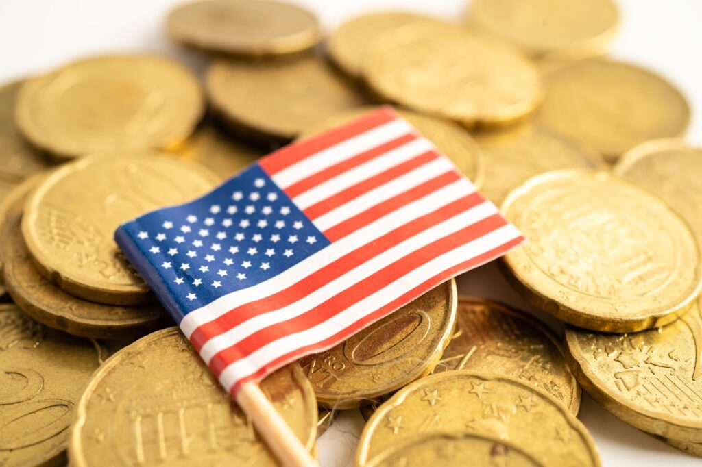 US flag on coins money, finance and accounting, banking concept.