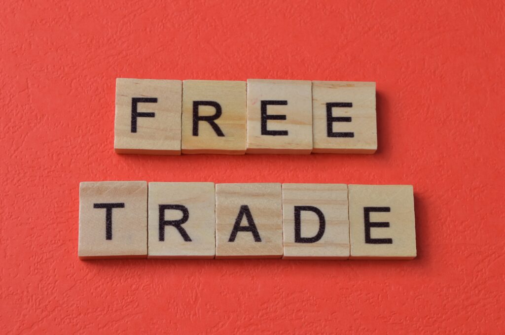 Wooden square letters with text FREE TRADE